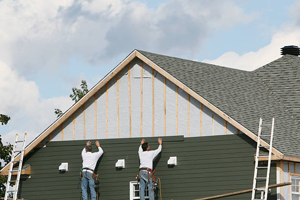 Professional Siding Replacement technician working in Medford, OR